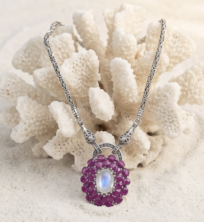 Isabella - Rare finding- 17.9 carat Rose Quartz Ruby .925 Sterling Silver handcrafted Statement Necklace - Moonstone ruby necklace on coral backdrop, front view close-up.
