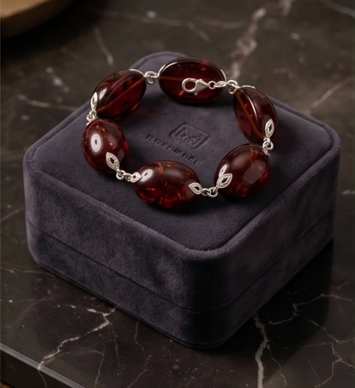 Excellent quality Cognac color Baltic Amber .925 Sterling Silver entirely handcrafted Bracelet - Cognac Baltic Amber bracelet on display box, top view.