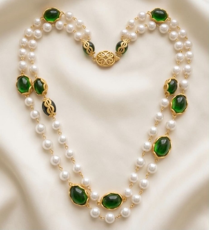 Incredible 48 inches long Freshwater Pearl 10K Gold over .925 Sterling Silver handmade Necklace - Pearl and green stone necklace with gold details, arranged on fabric.