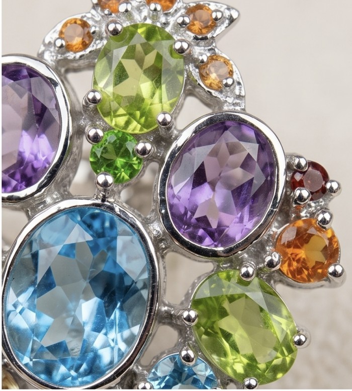Atlantica 33.7 carat Swiss Blue Topaz .925 Sterling Silver dipped in rhodium Handcrafted Statement Large earrings - Close-up of multicolored gemstone arrangement in sterling silver setting.