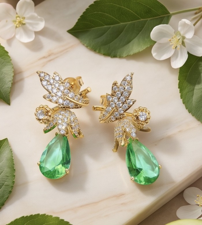 Luzurious 7.9 carat authentic Himalayan Peridot .925 Sterling Silver dipped in 14K Gold Handcrafted Statement Earrings - Elegant earrings with peridot and diamond details on a marble surface.