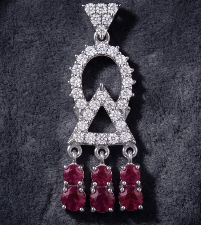 Precious - Art Deco 8.2 carat Ruby rhodium over .925 Sterling Silver handmade earrings - Art Deco ruby and diamond pendant close-up on textured background.
