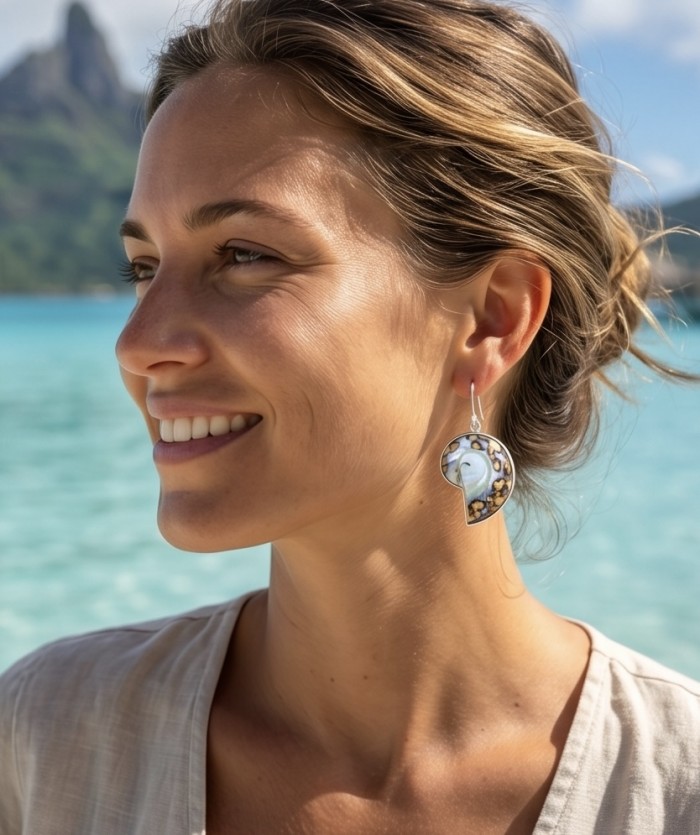 Fabulous Nautilus Ocean Shells .925 Sterling Silver handmade earrings - Side view of nautilus shell earrings worn by a woman.