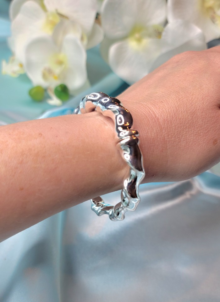 Fancy .925 Sterling Silver handcrafted Statement Italy made Bracelet - Sterling silver bracelet worn on wrist with floral background